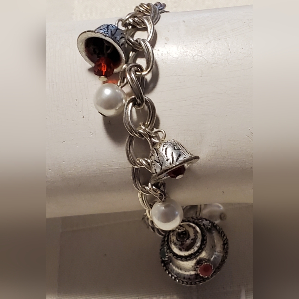 Elegant Sterling Silver Winter Charm Bracelet with Red and Pearl Accents.